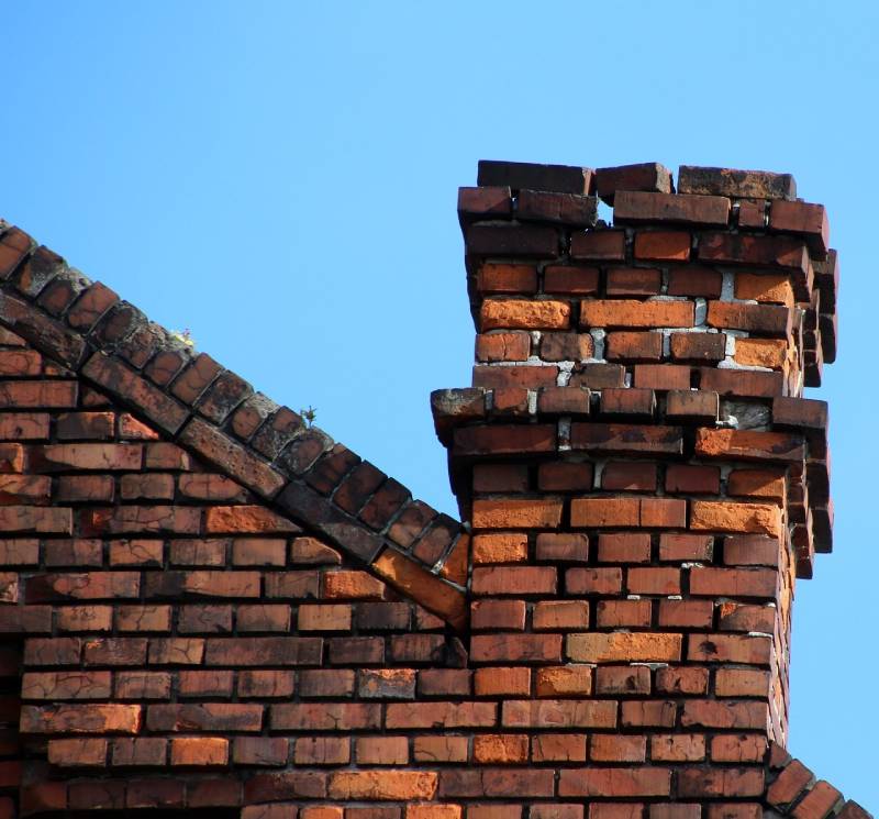 Signs Your Park Ridge Home Needs a Chimney Inspection Damaged chimney on an Park Ridge home showing cracks and missing mortar